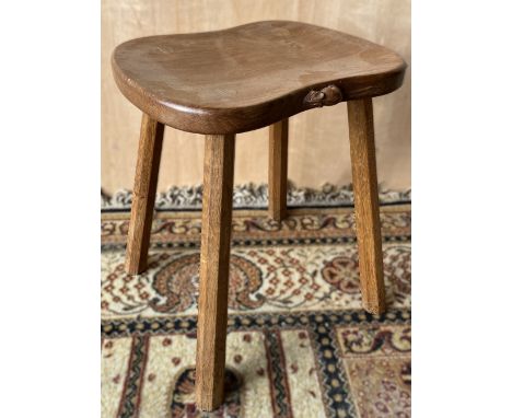Robert Mouseman Thompson of Kilburn - an oak cow stool, shaped rectangular adzed top on four octagonal outsplayed supports, c