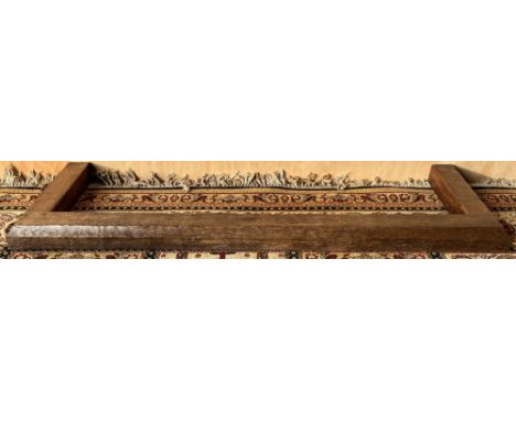 Robert Mouseman Thompson of Kilburn - an adzed oak fire kerb with bevel cut edge and carved with signature mouse, W140cm D41c