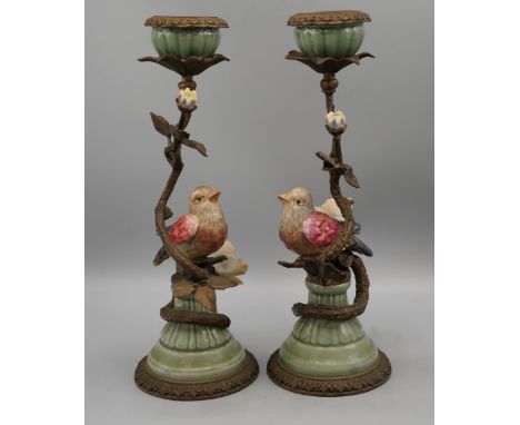 Pair of Wong Lee Regency style metal and ceramic candlesticks, modelled as polychrome birds and flowers with entwined branch 