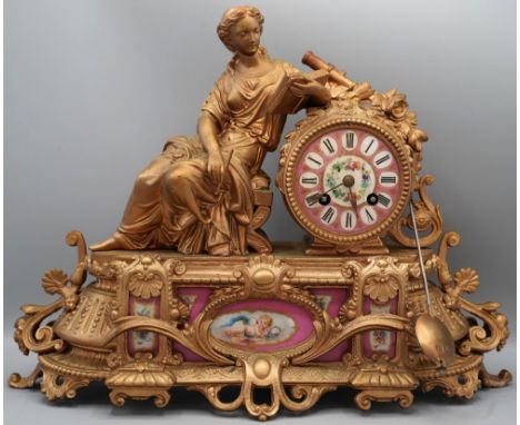 19th century French gilt figural Rococo style 8 day mantle clock, drum head case with seated female figure writing, over base