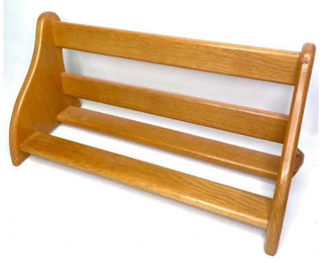 Geoff Unicornman Gell, Coxwold Cabinet Makers - an oak book trough, with slat back and shelf on shaped end supports, carved w