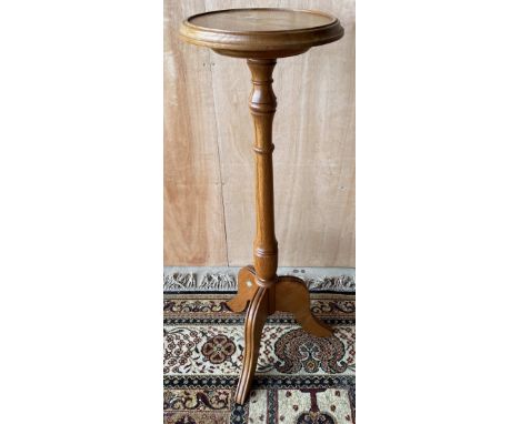 Geoff Unicornman Gell, Coxwold Cabinet Makers - an oak tripod plant stand, circular moulded top on tapering column and three 