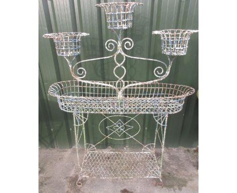 Victorian wirework conservatory planter with three circular baskets on two tier base with scroll feet, W104cm D34cm H140cm La