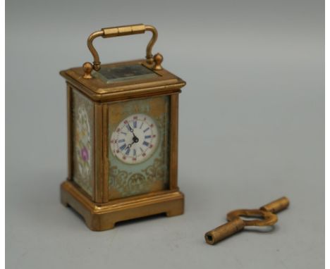 20th century French brass 8 day miniature carriage timepiece, plain case set with Serves style floral panels with gilt highli