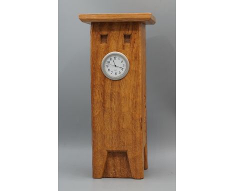Nigel Woodwormman Dixon of Topcliffe - an oak mantel clock, tooled case with shaped cornice, quartz movement with white Arabi