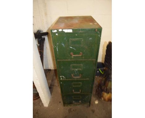 Metal filing cabinet containing various tools