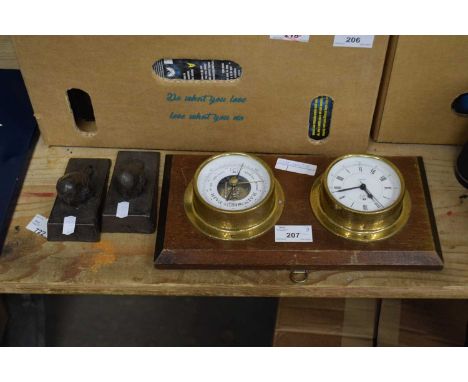 Small modern barometer and clock combination together with a pair of cast metal door stops