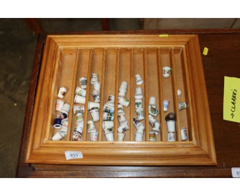 A display shelf and collection of thimbles