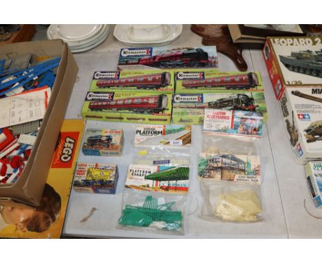 A collection of Kitmaster scale model trains and accessories