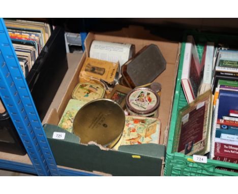 A box of vintage advertising tins