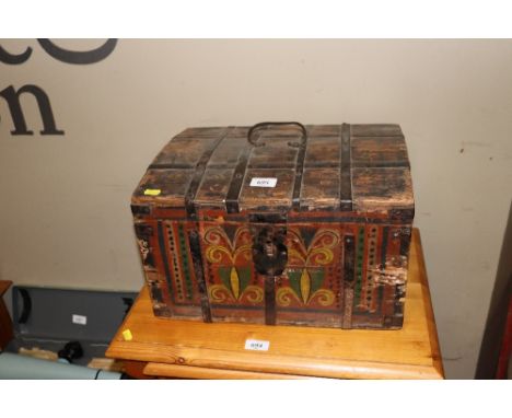 A painted and decorated metal banded dome top trunk