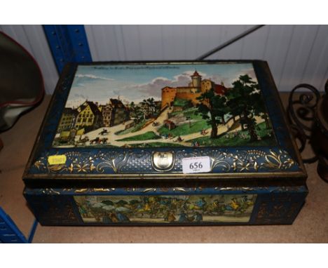 A vintage large German tin and a graduated pair of tins