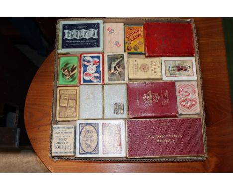 A tray of vintage playing cards and card games