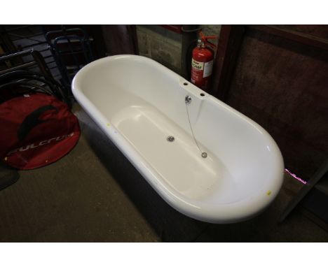 A Royce Morgan roll top bath raised on ornate style feet