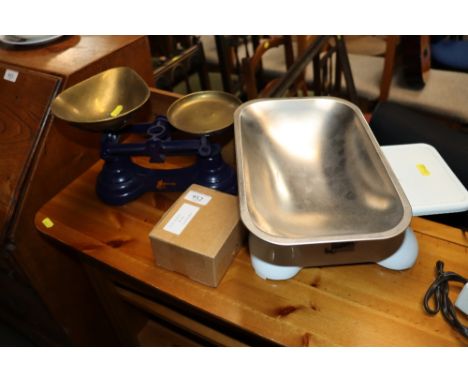 Two sets of scales and a box of weights