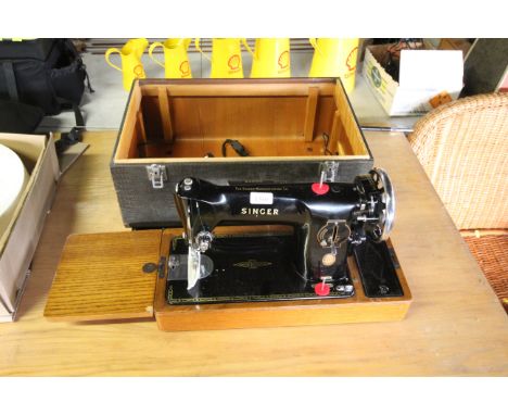 A vintage Singer electric sewing machine, sold as a collectors item