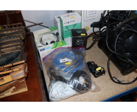 An Xbox 360 chat pad head set; a Flip video recorder; a blood pressure monitor; various cables; webcam etc