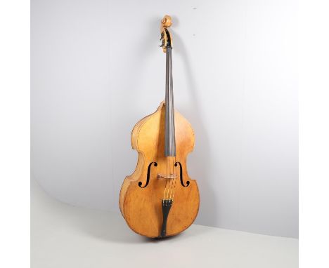 An antique double bass, with a carved scroll and brass winding pegs. No makers label, 190cms high.  *CR:  In used condition. 