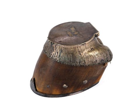 A horses hoof with a silver plated mount, with a small compartment inside and inscribed to the lid 'Ruby 1915'. With a silver