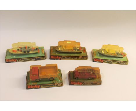 Various bubble wrapped models including 438 Ford Tipper Truck (orange cab, yellow tipper), 678 Air Sea Rescue Launch (x2), 67