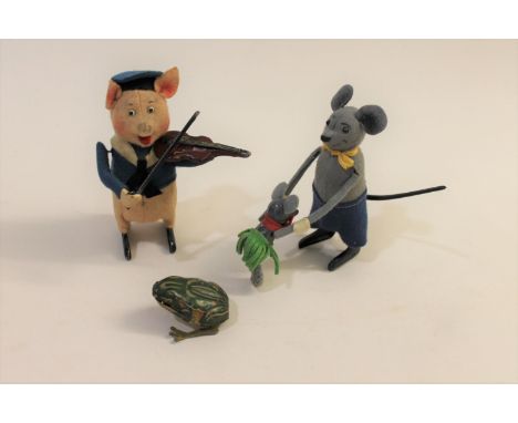 Two vintage clockwork Schuco toys, including a Pig playing a violin, and a Mouse holding a child which moves over its head (1