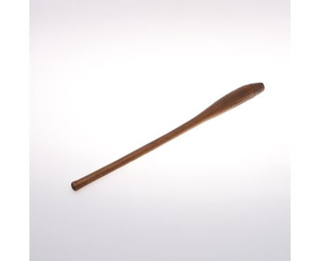 With a narrow handle and curved end, carved with various motifs including zig zag designs. 57.5cms long.  *CR:  Some small ch