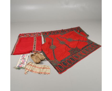 A late 19thc fine red cotton shawl from India, with chain stitched embroidered decoration worked in green and yellow silks (2