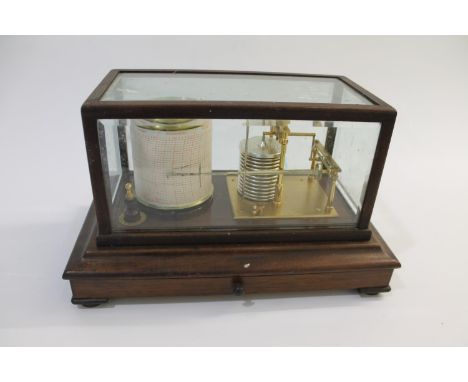 A mahogany cased Barograph with a cylindrical drum and clockwork mechanism. With a drawer to the base and stamped 'Short &amp