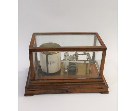 An oak based barograph with a temperature gauge, the drum with a clockwork mechanism (working) and with a drawer to the front