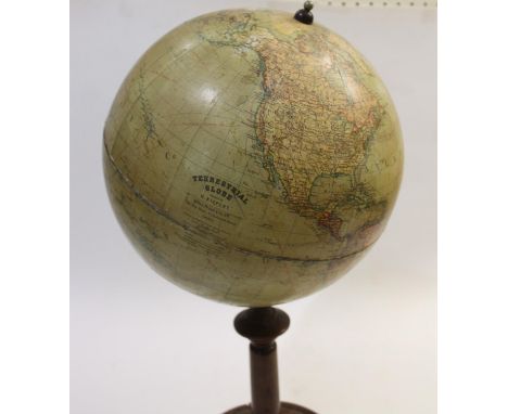 A terrestrial table globe by H Kiepert, retailed by 'Sifton, Praed &amp; Co Ltd, St James St, London'. The globe mounted on a