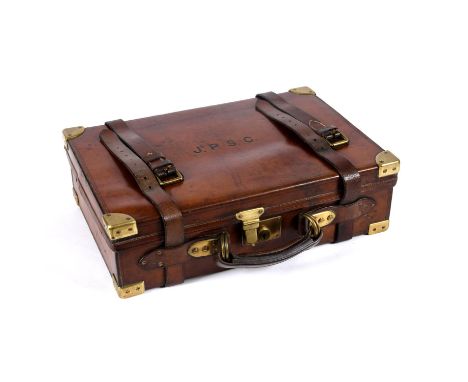 A wonderful quality leather case with brass corners and fittings, with an oak interior with dividers and leather straps. With