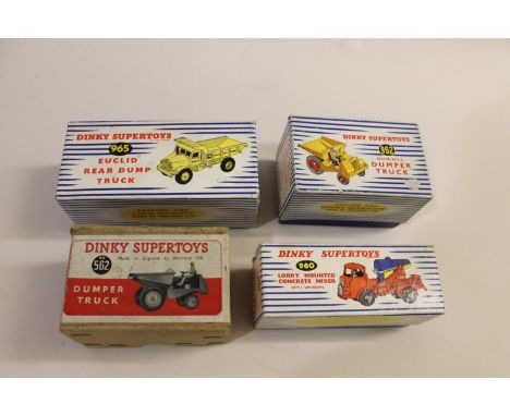 Boxed models including 960 Lorry Concrete Mixer (blue and yellow drum), 965 Euclid Dump Truck, 962 Muir Hill Dumper, and 562 