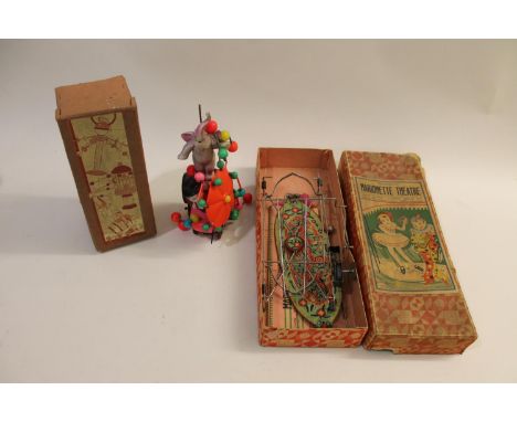 A mechanical Marionette Theatre, in its original box (no figures), made by CK (Japan). Also with a boxed Japanese clockwork E