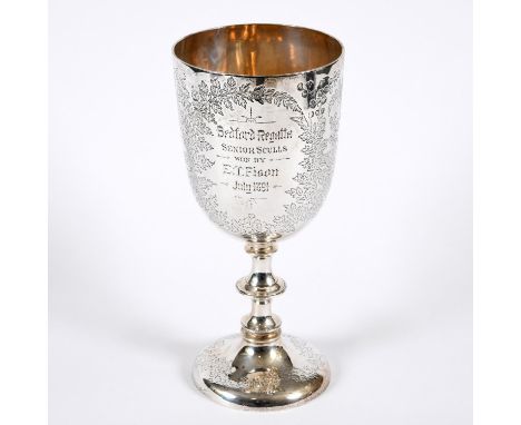 A large silver trophy cup, inscribed 'Bedford Regatta, Senior Sculls Won By E T Fison, July 1891'. Also engraved with various