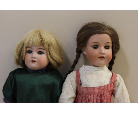 A Model No 370 doll, with fixed blue eyes, open mouth, leather body and celluloid lower arms, marked '370, 2 1/2, DEP, 18 1/2