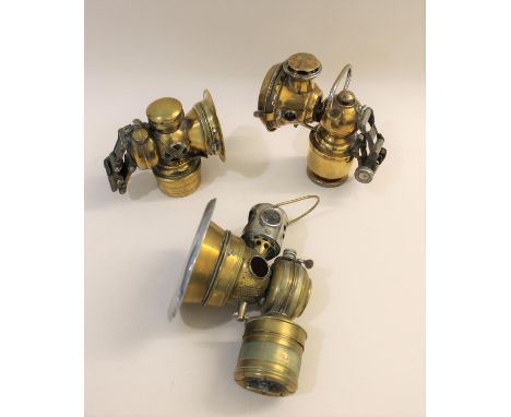 Including a German Haeckel brass carbide lamp, an American MFG Co brass lamp, and a Lucas 333 bicycle lamp. (3).  *CR:  See i