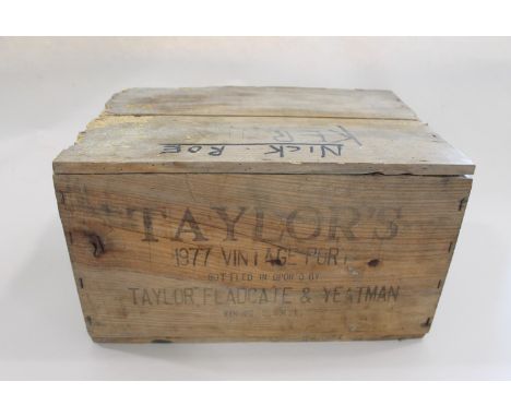 12 bottles of vintage 'Taylors Port, 1977', in an unopened wooden case. The case marked  'Taylor's Oporto, 1977 Vintage, Bott