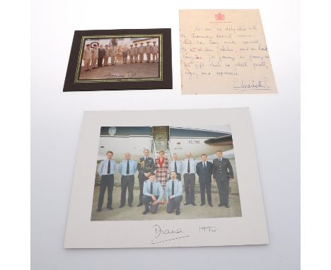 A photograph of Princess Diana with a flight crew in front of a Royal Plane, signed 'Diana, 1990', the photograph mounted on 