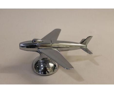 A chrome lighter in the form of an aeroplane, 16cms long.  *CR:  Generally good for its age, the odd mark and scratch as you 