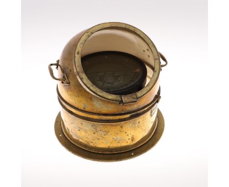 A ships binnacle compass, in a brass case with handles to each side. With a makers plaque for 'Simpson Lawrence, Glasgow'. 25