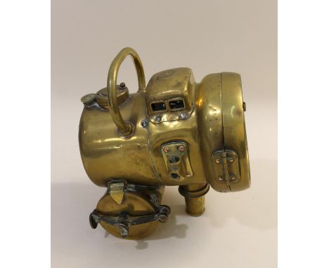 A self contained large brass acetylene lamp, with carrying handle. Marked for 'Powell &amp; Hanmer, Birmingham'. 27cms high. 