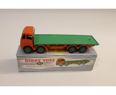 Including 902 Foden Flat Truck (orange cab, green flatbed), 409 Articulated Lorry, 582 Car Transporter (light blue), 965 Eucl