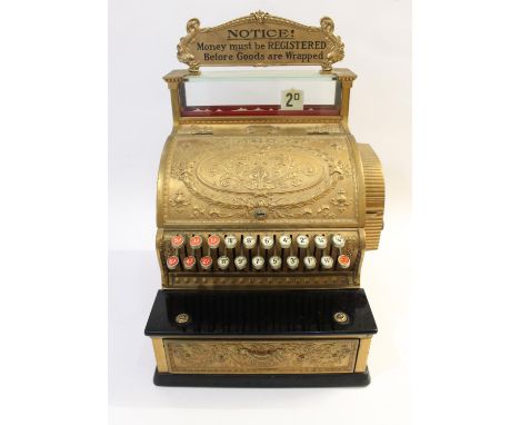 A Class 300 large brass antique cash register made by 'National', circa 1909. With a brass plaque to the top section 'Notice,