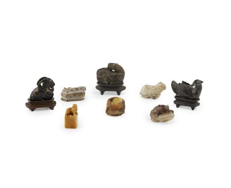 GROUP OF HARDSTONE CARVINGScomprising: a green and russet jade archer's ring, carved with a dragon; a yellow soapstone 'pixiu