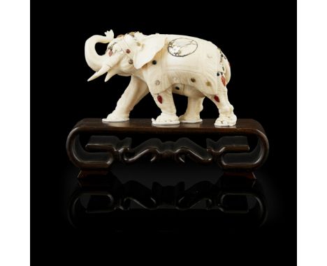 SHIBAYAMA-INLAID IVORY MODEL OF AN ELEPHANTMEIJI PERIOD modelled realistically in striding pose with trunk raised above the t