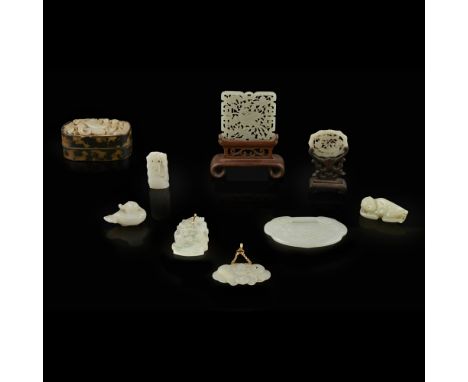 COLLECTION OF JADE CARVINGS19TH/20TH CENTURY comprising: a reticulated 'phoenix' plaque mounted on a wooden display stand; an