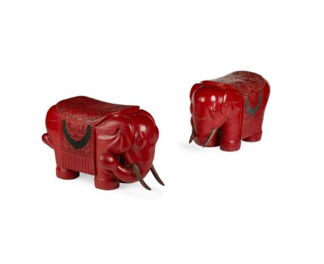 PAIR OF CINNABAR LACQUER ELEPHANT-FORM STOOLS20TH CENTURY the rotund animal standing foursquare with its trunk turned sidewar