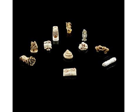 COLLECTION OF ELEVEN CARVED IVORY NETSUKEMEIJI PERIOD comprising: a human skeleton beating a wooden fish, signed Shozan; a ci