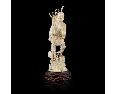 CARVED OKIMONO OF A WOODCUTTERSIGNED GYOKUYUKI, MEIJI PERIOD the figure shown standing on a rock, holding a peony in his left