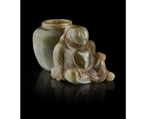 CARVED GREEN JADE BRUSHPOTcarved with a young man seated at rest and leaning against a jar functioning as the brush holder, t